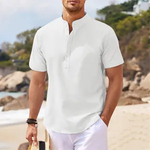 Close-up of men's white waffle knit shirt with stand collar and pineapple pattern detail.