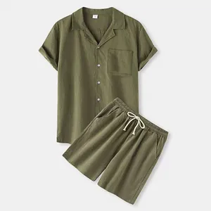 Men's olive green cotton set showing texture of short-sleeve shirt and drawstring shorts