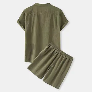 Macro view of the back of an olive green linen short sleeve shirt and shorts set