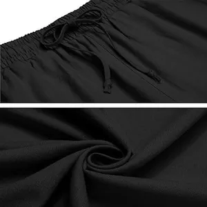 Macro detail of black cotton linen pants showing waistband and texture.