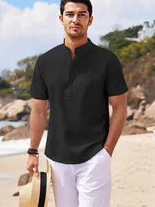 Men's black waffle knit Henley shirt with stand collar and short sleeves in beach setting.