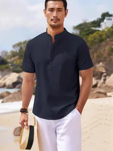 Men's navy short sleeve mandarin collar shirt with waffle pineapple texture on beach