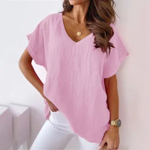 Close-up of pink V-neck batwing sleeve linen T-shirt showing fabric texture and fit