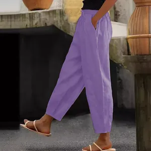 Detail of women's purple cotton linen casual pants with elastic waist and side pockets.