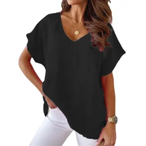 Detail of black V-neck cotton linen T-shirt with batwing sleeves and loose fit