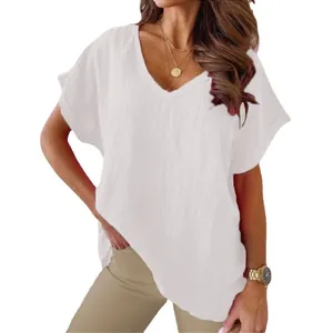 Close-up detail of women's casual white V-neck cotton linen top with batwing sleeves.