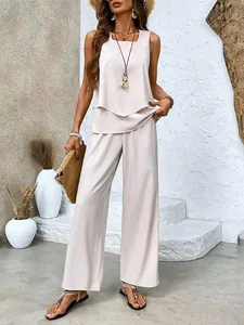 Two-piece set with sleeveless double-layer tank top and elegant wide-leg trousers in beige.
