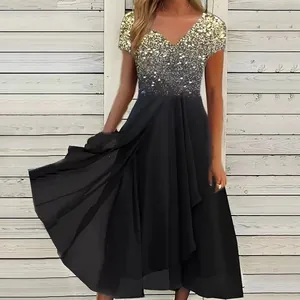 Elegant women's V-neck dress featuring gold sequined top and flowing black chiffon skirt