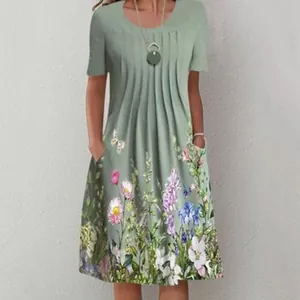 Close-up detail view of women's casual green floral print midi dress with pockets