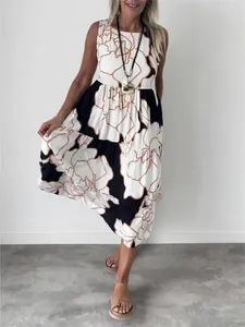 Elegant sleeveless floral print tiered maxi dress featuring black and white flower pattern