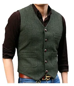 Detailed view of men's dark green tweed V-neck vest for wedding groomsmen and grooms.