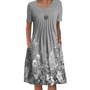 Detailed view of women's grey floral print midi dress with round neck and functional pockets