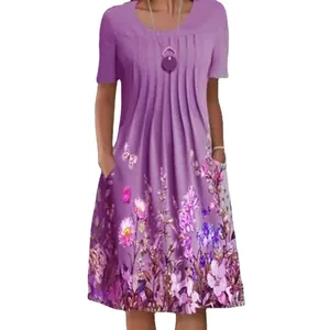 Detailed view of a purple mid-length dress featuring vibrant floral print and side pockets