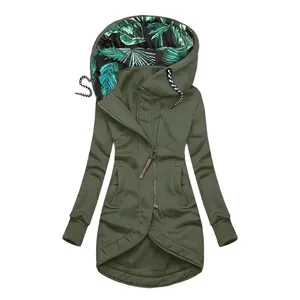 Detail view of army green zip-up hoodie with tropical leaf print lining.