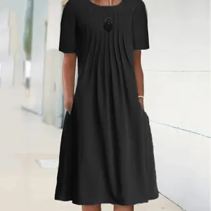 Elegant black solid color midi dress featuring chest pleats and practical side pockets.