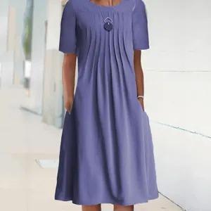 Detailed view of women's purple short sleeve pleated midi dress with pockets