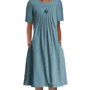 Close-up of a women's short sleeve solid blue midi dress with pleated front detail