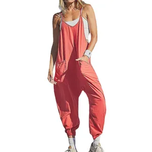 Comfortable coral women's loose jumpsuit with thin straps and large front pockets