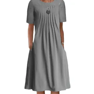 Detailed view of gray short sleeve midi dress with pleated neckline and pockets.