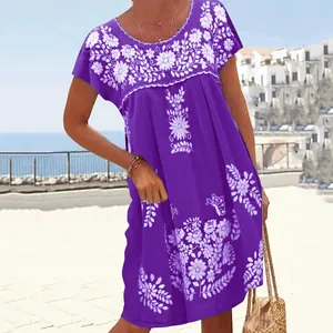 Macro view of purple ethnic style dress featuring detailed white floral embroidery