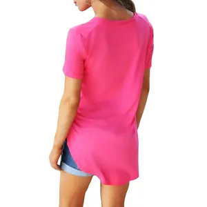 Back view of hot pink short sleeve T-shirt for women featuring a high-low curved hem design.