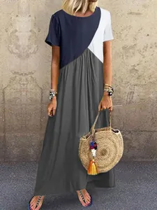 Detailansicht eines geometrischen Colorblock-Patchwork-Maxikleids für den Sommerstrand