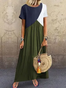 Ein stilvolles Maxikleid mit geometrischem Farbbloching für den Sommerurlaub am Strand