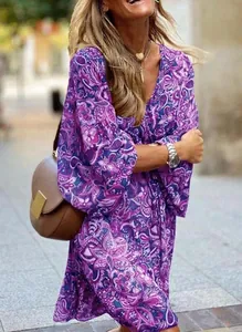 Detail view of purple paisley print bohemian summer dress with V-neck