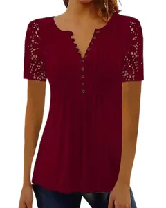 Close-up of burgundy t-shirt featuring intricate lace sleeves and pleated button V-neck detail.