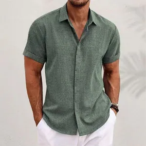 Macro detail of men's linen short sleeve shirt in sage green with button-down collar