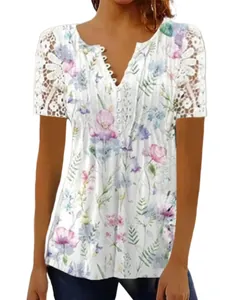 Close-up detail of women's floral print t-shirt with lace sleeves and button V-neck