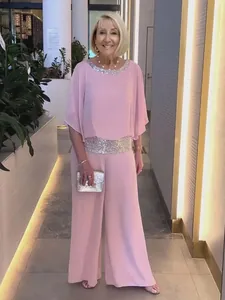 Elegant pink two-piece set featuring sequined batwing top and wide leg trousers for women