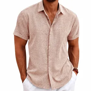Close-up detail of men's linen short sleeve shirt in tan showing the fit and fabric
