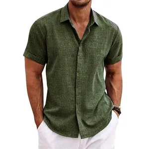 Macro view of olive green linen short sleeve shirt on model with visible fabric texture