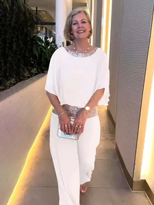 Elegant white women's two-piece set featuring sequin neckline and batwing sleeves detail