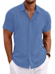Close-up detail of blue men's linen short-sleeved shirt with textured fabric and button collar