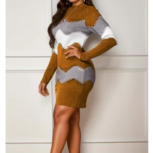 Close-up of the elegant zigzag knit pattern on a brown long sleeve bodycon dress