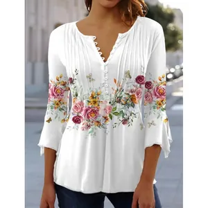 Elegant white floral print V-neck blouse with pleated details, buttons and flared sleeves