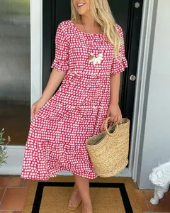 Casual pink and white printed tiered midi dress with short sleeves and round neck