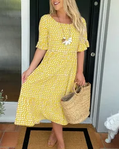 Summer yellow polka dot ruffle midi dress with round neck and tiered skirt detail
