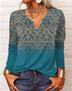 Haut femme bleu canard à col en V et manches longues avec motif floral baroque vintage.