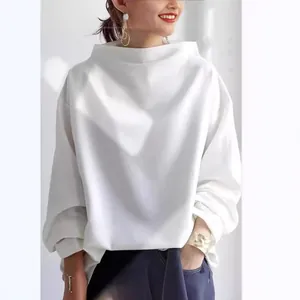 Elegant loose-fit white long sleeve top with unique high neck design