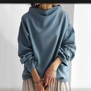 Loose casual blue mock neck top for women with elegant soft drape