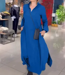 A detailed side view of a casual solid color V-neck long-sleeved blue maxi dress on model