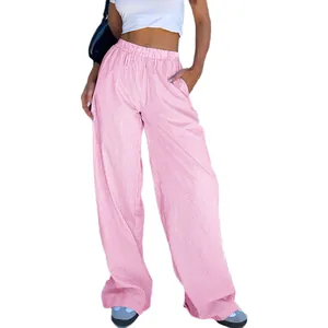 Close-up of pink and white striped wide-leg pants with high elastic waist and pockets