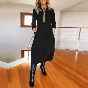 Elegant women's black long sleeve round neck loose midi dress with side pockets for autumn