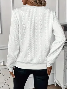 Back view of women's white cable knit pullover sweatshirt showing detailed texture