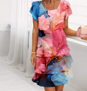 Close-up of a chiffon dress featuring a vibrant 3D floral print in pink and blue