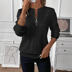 Women's black quilted pullover sweatshirt with half-zipper collar and textured pattern