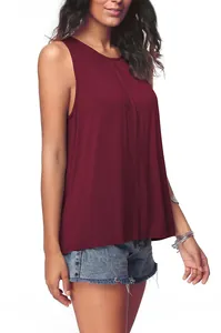 Detailed view of burgundy sleeveless top with pleated neckline and soft fabric texture.